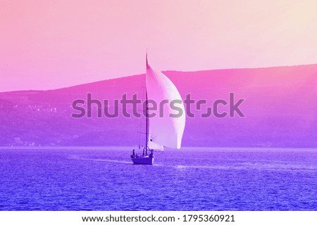 Sailing boat on the water, gradient toning. Montenegro, Bay of Kotor. Travel concept