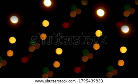 Bokeh light, beautiful colored circles on a black background,photo wallpaper,abstraction. Texture colorful picture.Christmas lights.