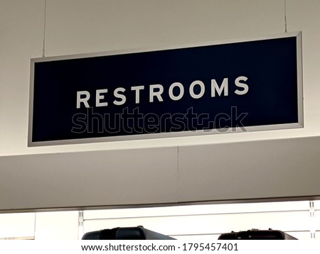 A Restrooms Signage Inside of a Retailer