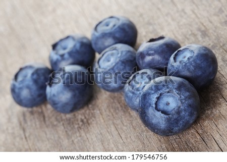 fresh blueberries on wood table, rustic style