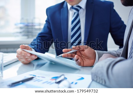 Image of two businessmen discussing computer project Royalty-Free Stock Photo #179549732