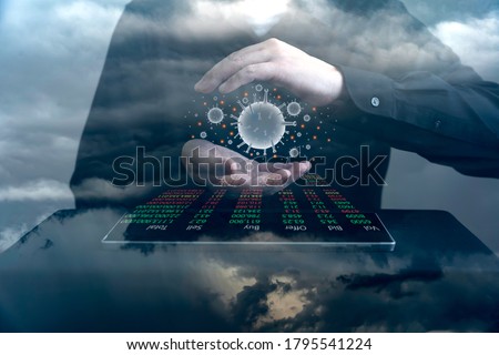 Closeup businessman hand with digital tablet protecting covid or coronavirus to business and stock trading graphic, Covid19 vaccine and economic recovery concept Royalty-Free Stock Photo #1795541224