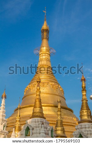 The stupa of the Shwedagon Pagoda in the evening sunlight, in Yangon, Myanmar