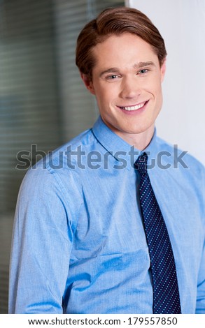 Happy young casual handsome businessman
