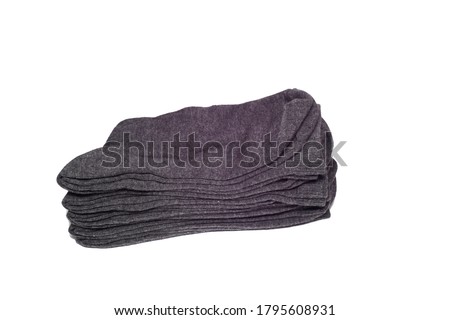 Men's socks are dark and rolled up. on an isolated white background. stacked, rolled up