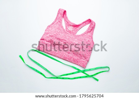 A female sports fitness vest and tape measure