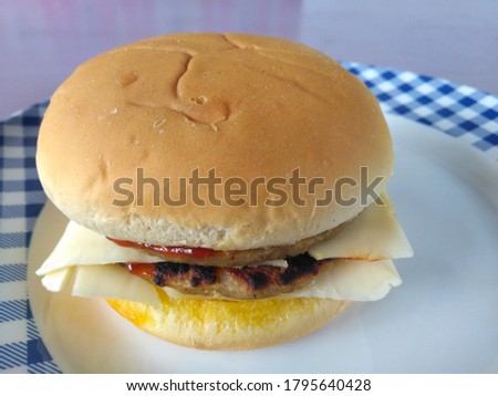 Close view of doble cheese burger. 