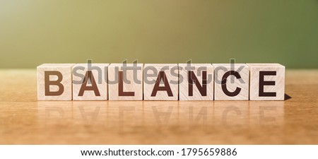 word written on wooden blocks on wooden table. Concept for your design. Balance work and life, health balance, financial