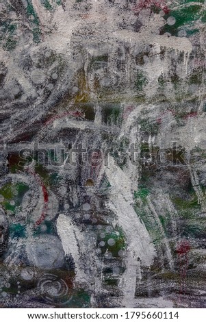 Modern Iconic Culture - Graffiti. Wall is decorated with paint with abstract signatures and drawings. Fragment for background. Contemporary urban culture, street youth protest vandalism