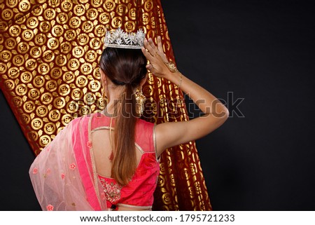Indian beauty face perfect make up wedding bride, Portrait of a beautiful woman in Red Pink traditional India bridal costume with Diamond crown for Miss beauty queen pageant Royalty-Free Stock Photo #1795721233