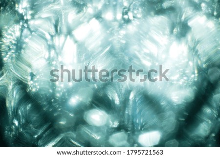 Easy to add lens flare effects for overlay designs or screen blending mode to make high-quality images. Abstract sun burst, digital flare, iridescent glare over black background. Drops on glass.