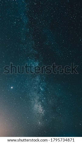 A close up of the milky way on deep blue tones