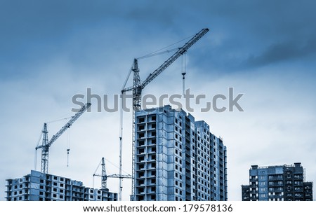 Tower cranes and modern buildings under construction 