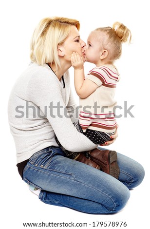 Happy mother and daughter kissing, isolated on white background