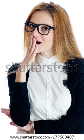 portrait of a surprised  business woman with hands at mouth wearing black frame glasses over white