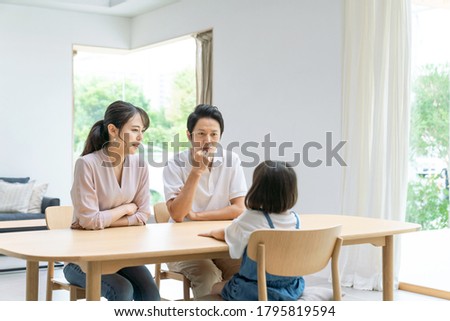 Asian family in modern interior. Lifestyle concept. Royalty-Free Stock Photo #1795819594