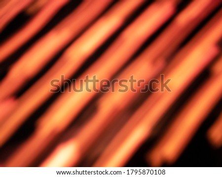 defocused Orange light streaks Diagonal stripes background in low shutter speed condition can use for overlay, texture and background in graphic design. technology concept.