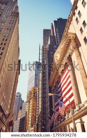 Vintage toned picture of Wall Street in Manhattan, New York City, USA.
