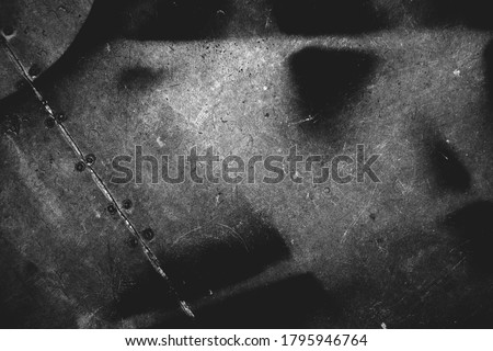Photo of old scratched surface texture in black colors