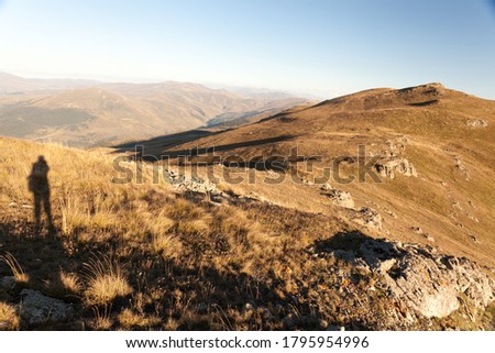 Silhouette of a man against the background of high mountains