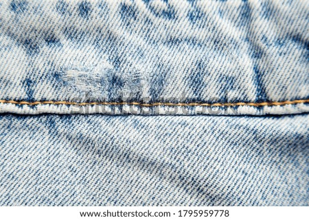 blue denim fabric as background. jeans close-up. cotton fabric
