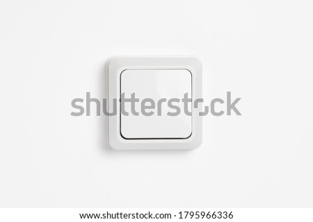 Wall Light Switch Isolated on a White Background.Wall plate.High resolution photo.Top view. Royalty-Free Stock Photo #1795966336