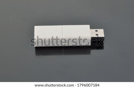 Close up view of a pen drive on a gray background
