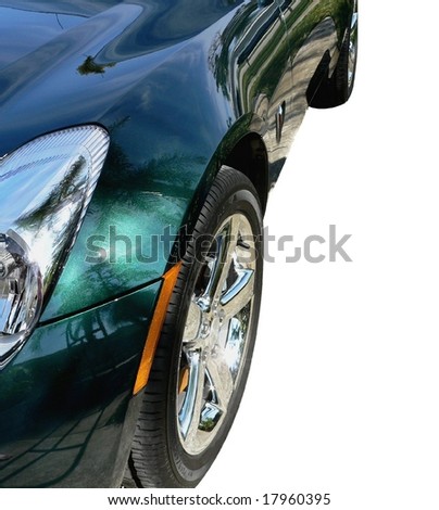 Left front quarter panel of metal flake green sports car including chromed wheel
