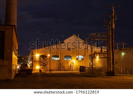 Night view of a factory with nice light, industrial concrete.
