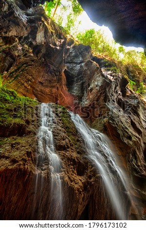underground waterfall going down through rocks in Zhaoyang ground beam, Hunan, China