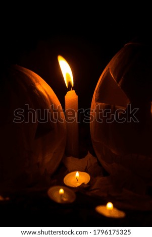 Photo of pumpkins, candles, leaves for the autumn Halloween holiday