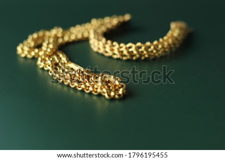 Gold ornament in various styles isolated on dark green background. 