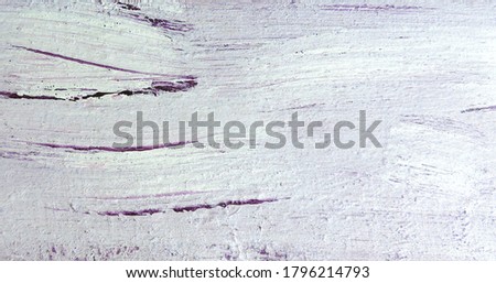       the wooden surface is painted with strokes of pink lilac paint    