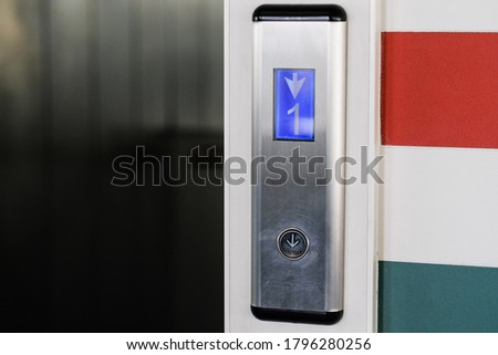
elevator button in a residential multi-storey building