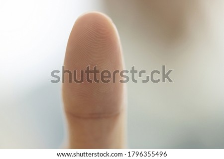 Close up of finger print on woman thumb