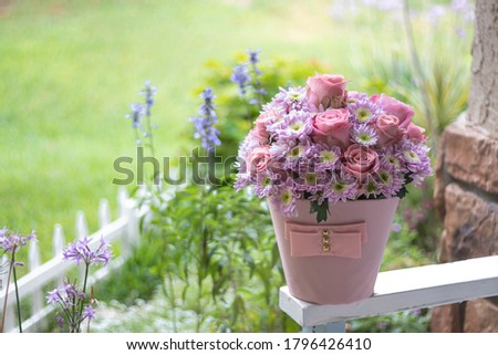Fresh bouquet of pink roses on  the Bech at the front porch. Home sweet home. House decorations. Garden images. Home gardening.