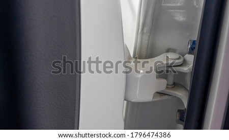 Close up of modern car door hinges Royalty-Free Stock Photo #1796474386
