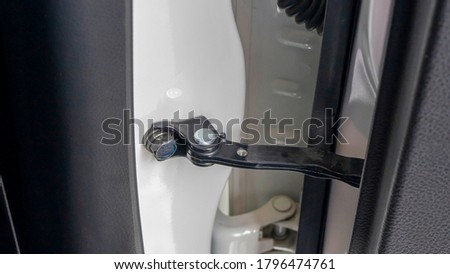 Close up of modern car door hinges Royalty-Free Stock Photo #1796474761