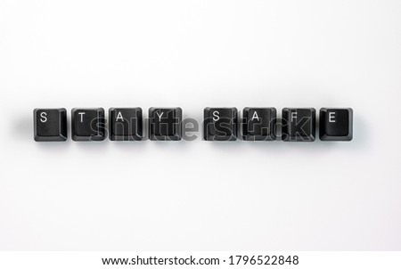 Computer keyboard keys spelling Stay Safe, isolated on white background
