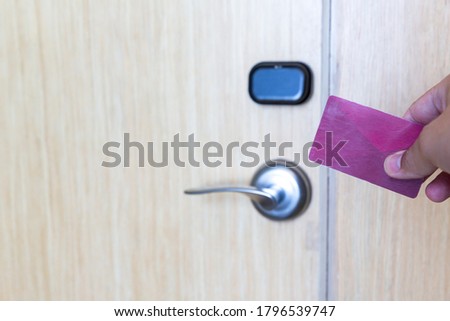 Hand Hold Key card Hotel room access. Electronic key system to lock and unlock doors. 