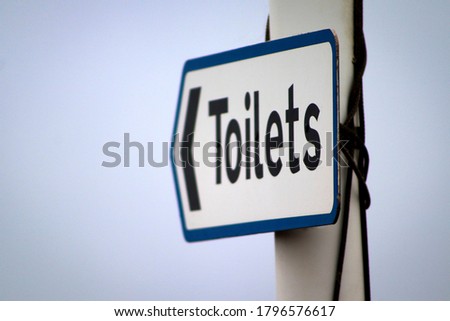 Public toilets street signpost UK