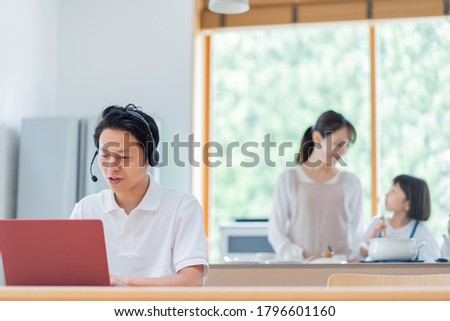 Mother, daughter and mother working at home