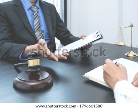 The male lawyer is providing service to consult business dispute to businessman.