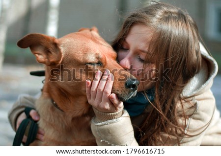 Girl kissing hugging red dog pupppy cute lovely friendly high resolution photography