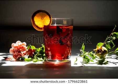 

Cold tea with beautiful light and flowers