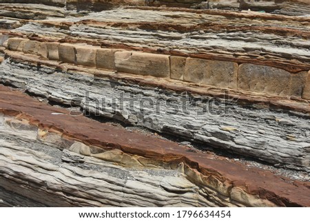 Landscape photos of Nanya Rocka, sandstone sea stack, cross stratum, coral-eroded shore with a striped appearance from oxidation, Ruifang District, New Taipei City, Taiwan, Royalty-Free Stock Photo #1796634454