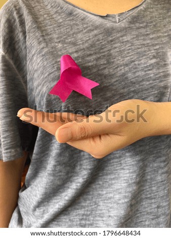 Pink bow, a symbol of encouragement for breast cancer patients.