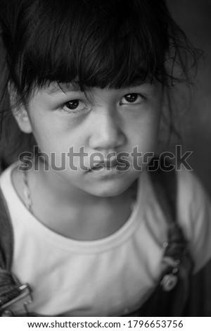 Asian child with a sad face