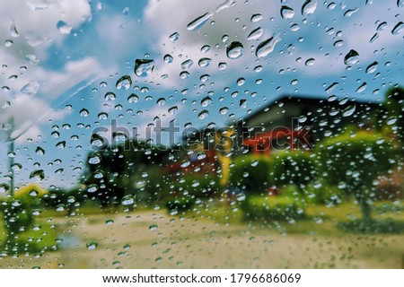 View through a car window on a rainy day. Selective focus.