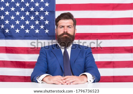 American patriotism. American citizen in formal wear. Bearded man on american flag background. Independence day. July 4th. 
